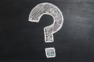 A conceptual image featuring a question mark drawn on a chalkboard, ideal for problem-solving contexts.